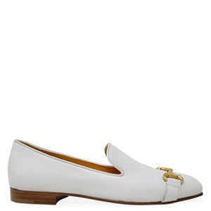 White loafer shoe with gold buckle on a white background