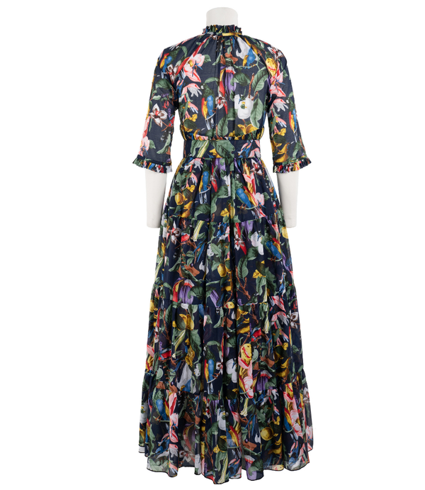 A knee-length dress with a collared neckline, three-quarter sleeves, and a flared skirt. Features a bold allover abstract pattern and fitted waist.
