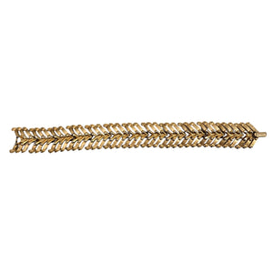 gold tone bracelet on white background 
