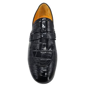 Black crocodile-patterned loafer shoe on a white background