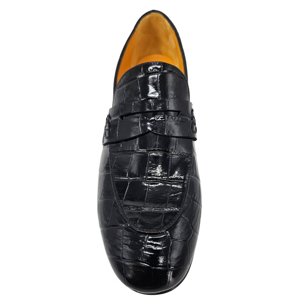 Black crocodile-patterned loafer shoe on a white background