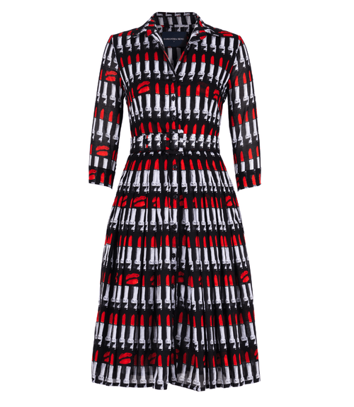 A knee-length dress with a collared neckline, three-quarter sleeves, and a flared skirt. Features a bold allover abstract pattern and fitted waist.