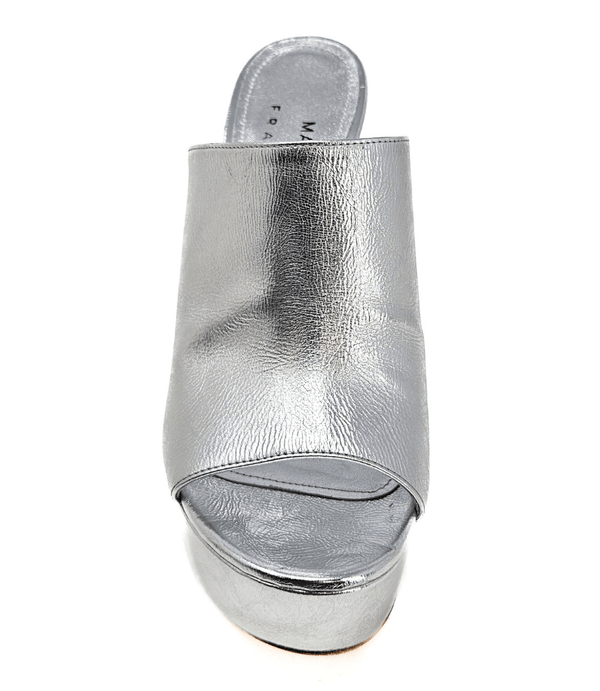 Open-toe platform mule with high block heel and wide upper strap. Features a smooth, metallic-textured finish and slip-on design for elevated wear.