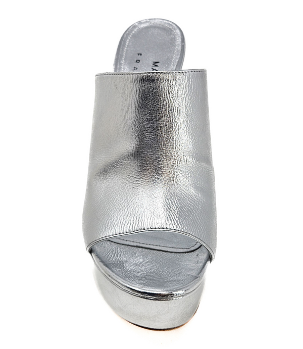 Open-toe platform mule with high block heel and wide upper strap. Features a smooth, metallic-textured finish and slip-on design for elevated wear.