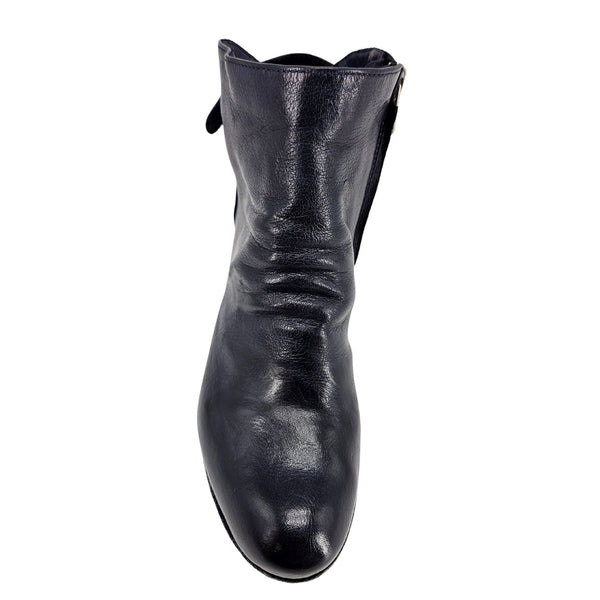 Black leather boot on a white background