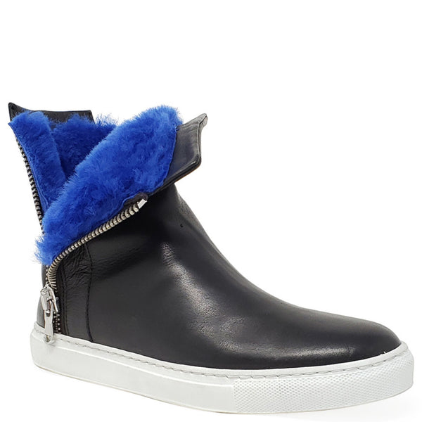 Black ankle boot with blue fur lining on a white background