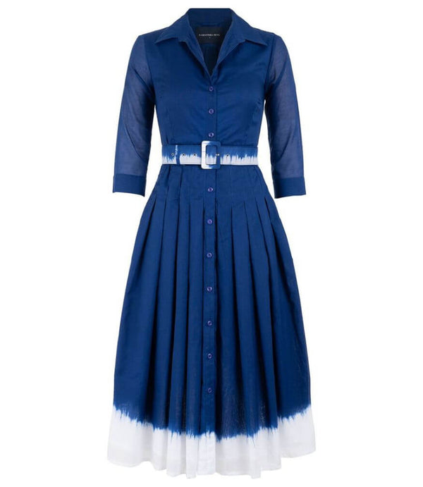 A knee-length dress with a collared neckline, three-quarter sleeves, and a flared skirt. Features a bold allover abstract pattern and fitted waist.