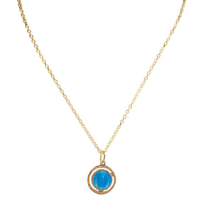Gold necklace with a blue pendant on a white background