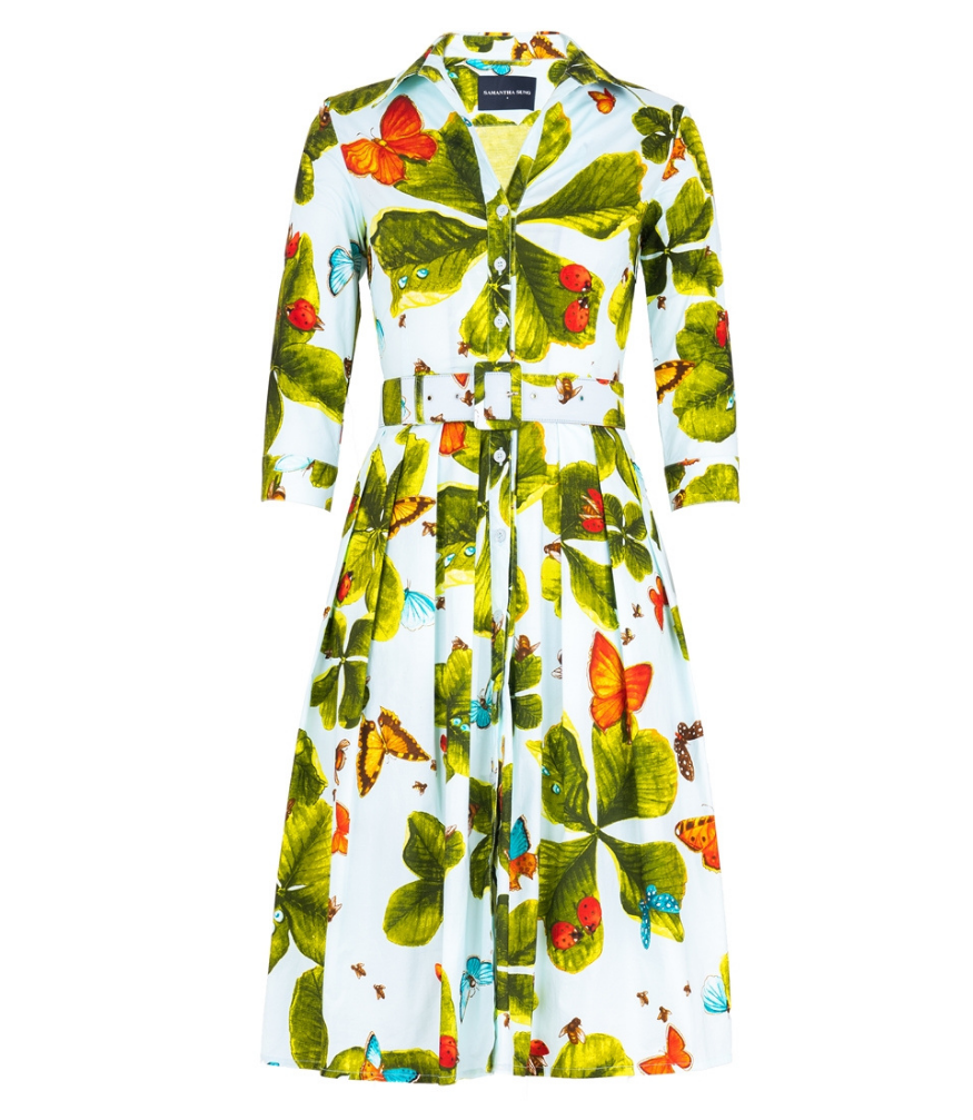A knee-length dress with a collared neckline, three-quarter sleeves, and a flared skirt. Features a bold allover abstract pattern and fitted waist.