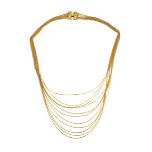 Gold necklace with multiple strands on a white background