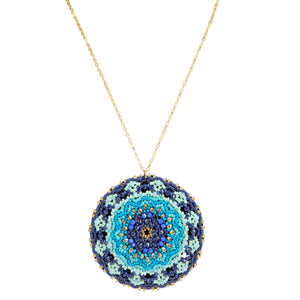 Necklace with a circular beaded pendant on a white background