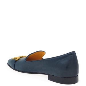 Blue shoe with yellow interior on a white background