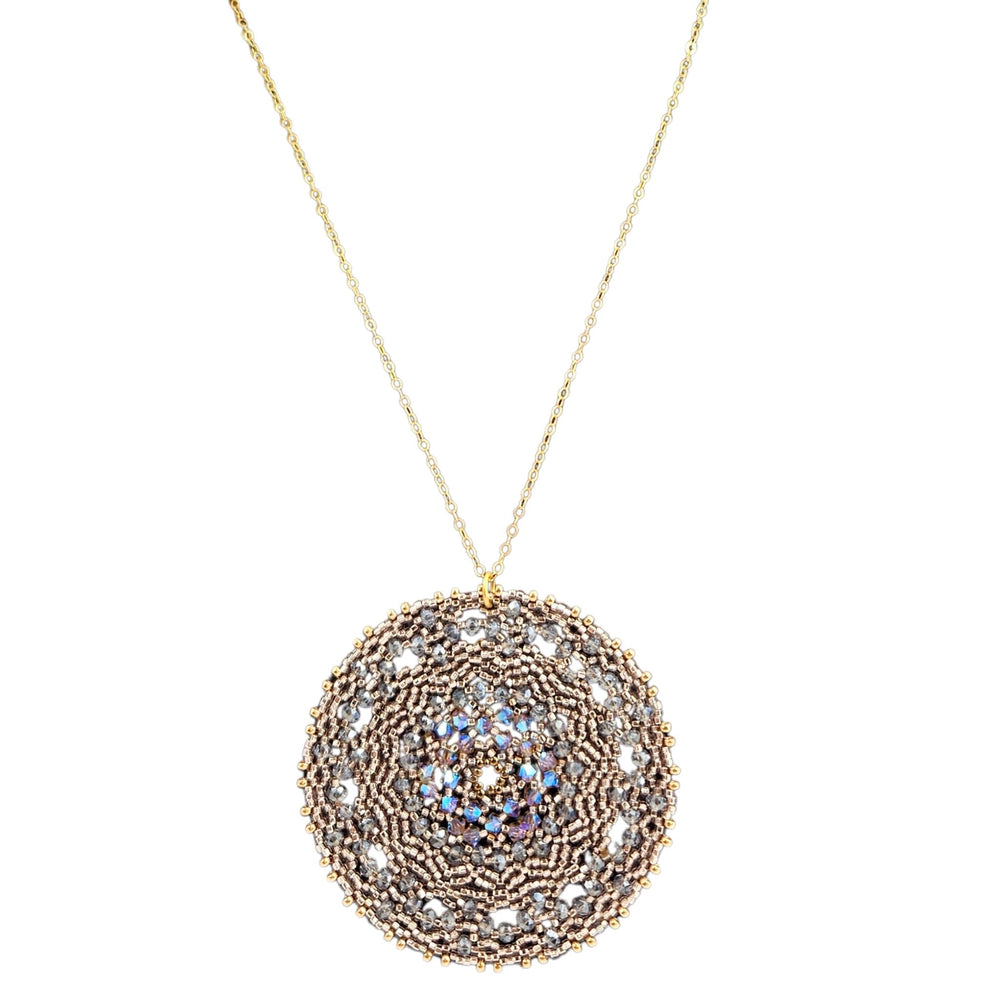 Decorative necklace with a circular pendant on a white background
