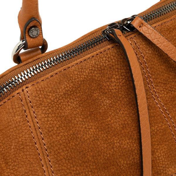 Close-up of a brown leather bag with a zipper