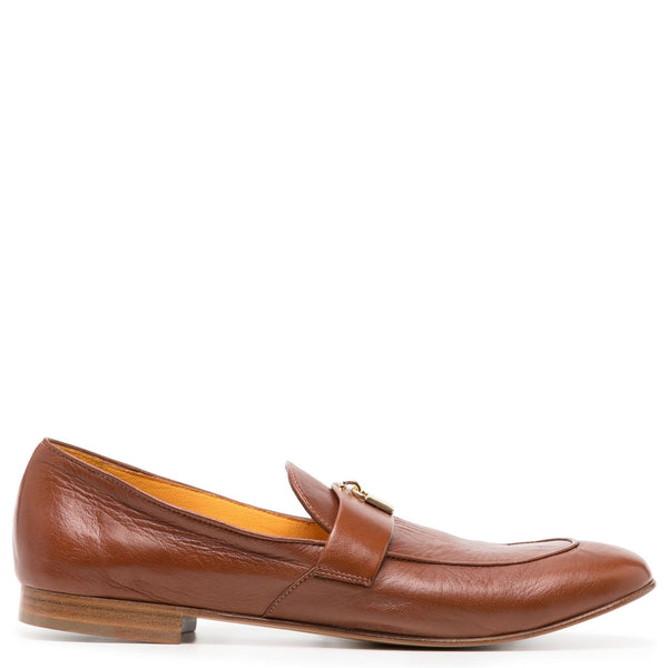 Brown leather loafer shoe on a white background