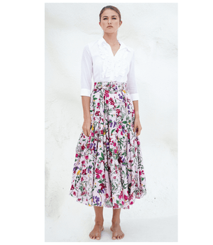 A knee-length dress with a collared neckline, three-quarter sleeves, and a flared skirt. Features a bold allover abstract pattern and fitted waist.