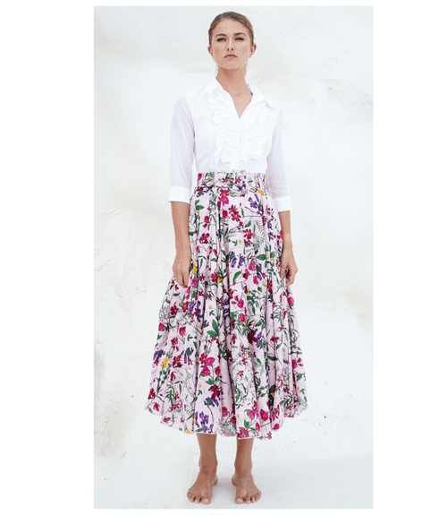 A knee-length dress with a collared neckline, three-quarter sleeves, and a flared skirt. Features a bold allover abstract pattern and fitted waist.