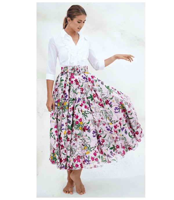 A knee-length dress with a collared neckline, three-quarter sleeves, and a flared skirt. Features a bold allover abstract pattern and fitted waist.