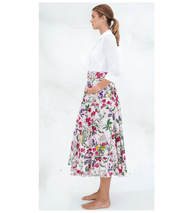 A knee-length dress with a collared neckline, three-quarter sleeves, and a flared skirt. Features a bold allover abstract pattern and fitted waist.