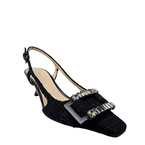 Black sandal with crystal embellishments on a white background