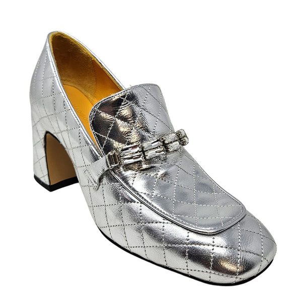 Silver metallic loafers with a block heel on a white background