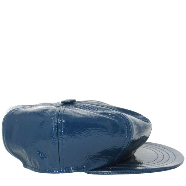 Blue patent leather cap on a white background