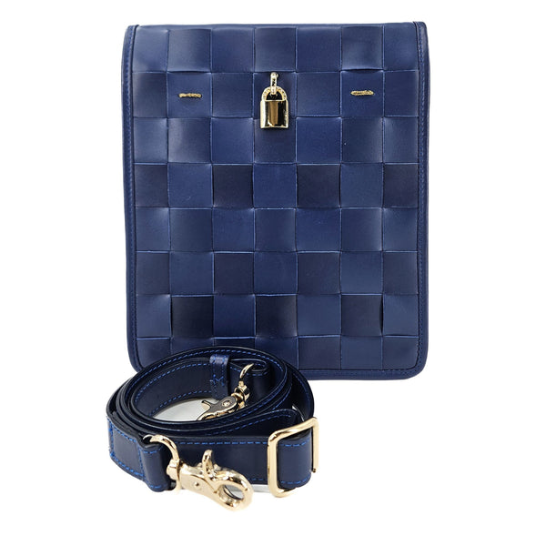 Blue woven handbag with gold accents on a white background