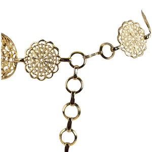 Gold necklace with floral and chain design on a white background