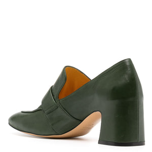 Green leather shoe with a block heel on a white background