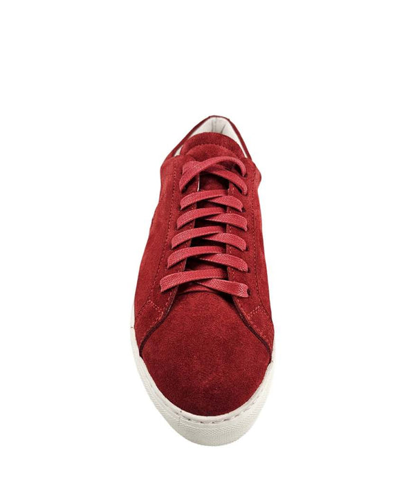  Side profile of a red suede sneaker with a dark blue star applique on the outer side. The sneaker features red laces, a white rubber sole, and a light-colored lining.