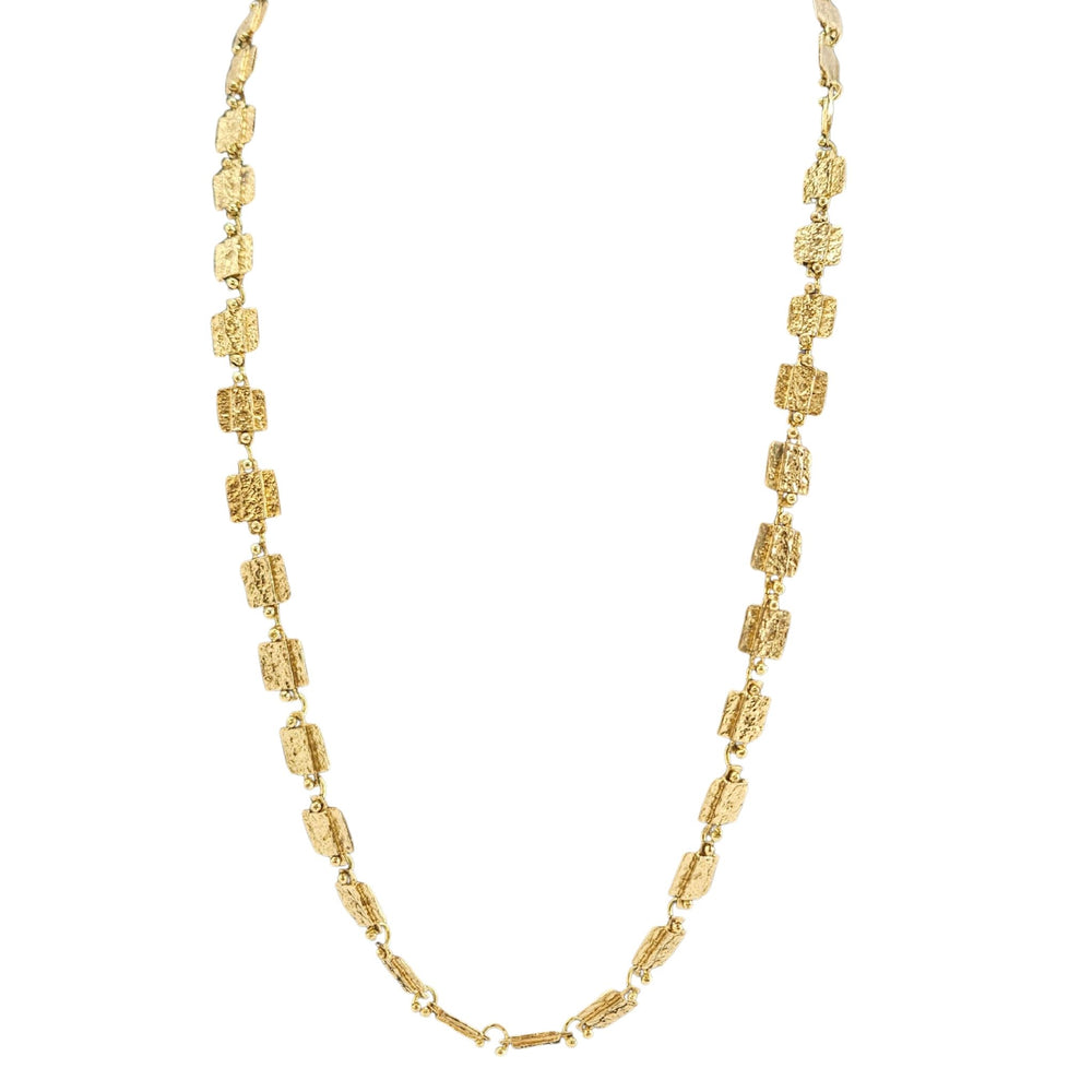 Gold necklace on a white background