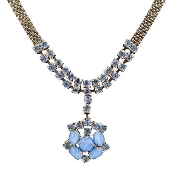 Necklace with blue gemstones on a white background