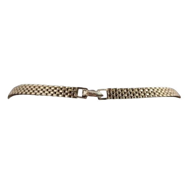 Gold mesh watch strap on a white background