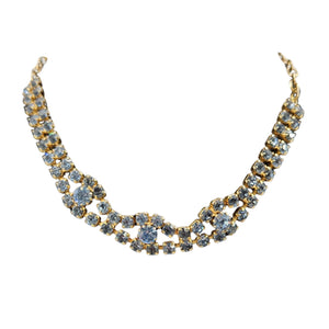 Gold and blue necklace on a white background