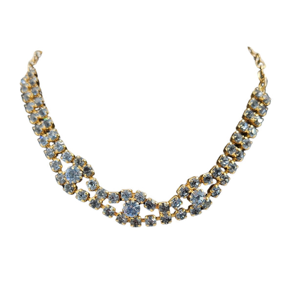 Gold and blue necklace on a white background