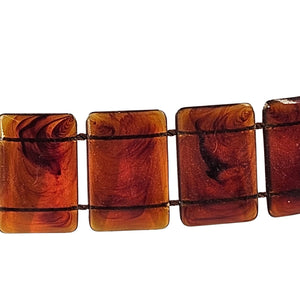 Brown rectangular beads on a white background