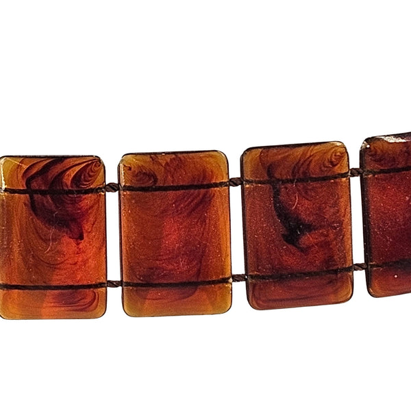 Brown rectangular beads on a white background