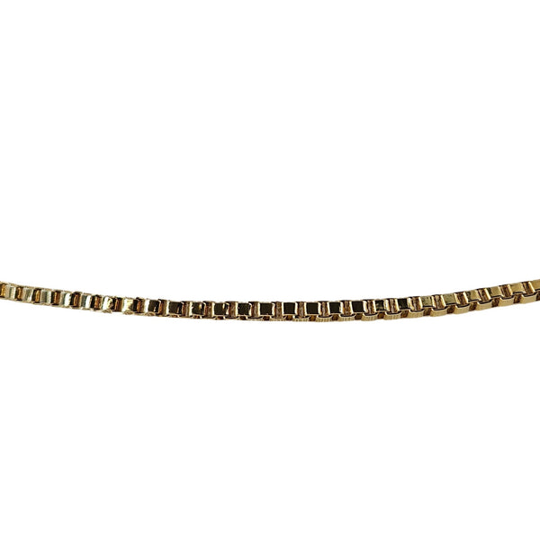 Gold bracelet on a white background