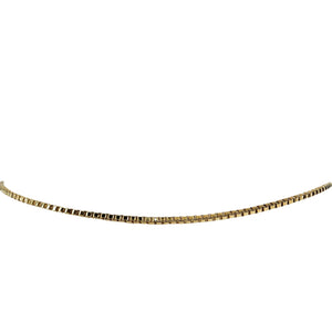 Gold chain necklace on a white background