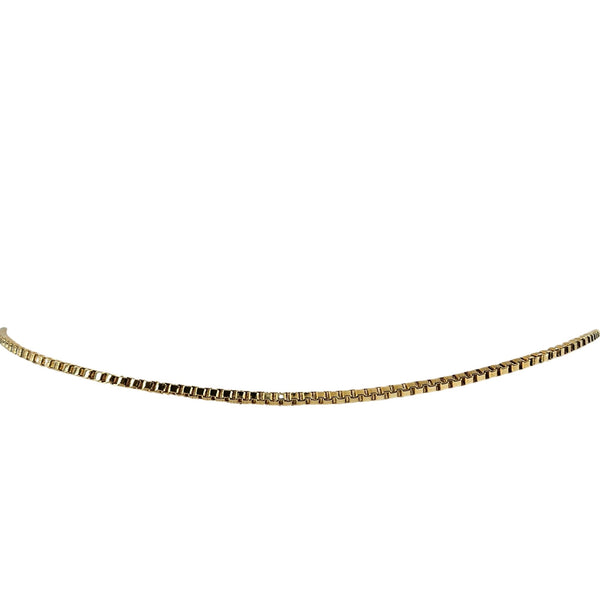 Gold chain necklace on a white background