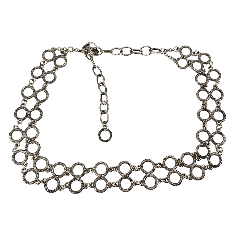 Silver chain necklace on a white background