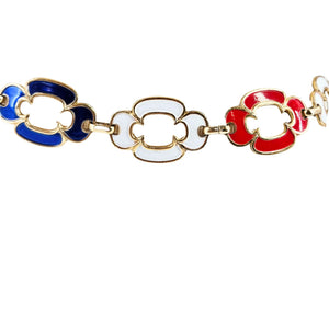 Bracelet with red, white, and blue floral links on a white background