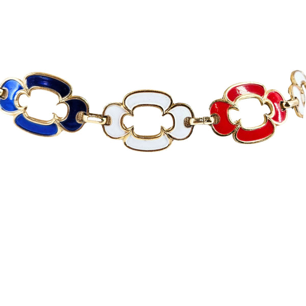 Bracelet with red, white, and blue floral links on a white background