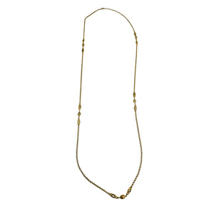 Gold necklace on a white background