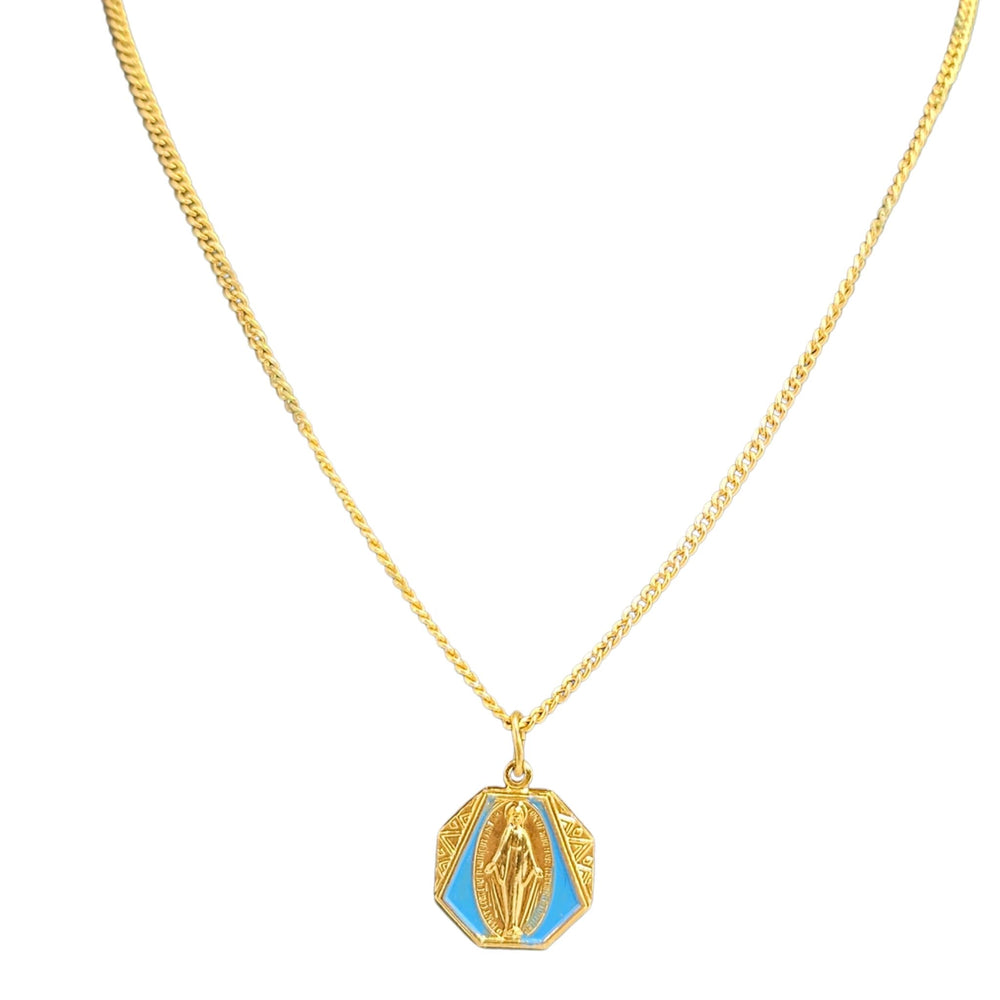 Gold necklace with a blue pendant on a white background