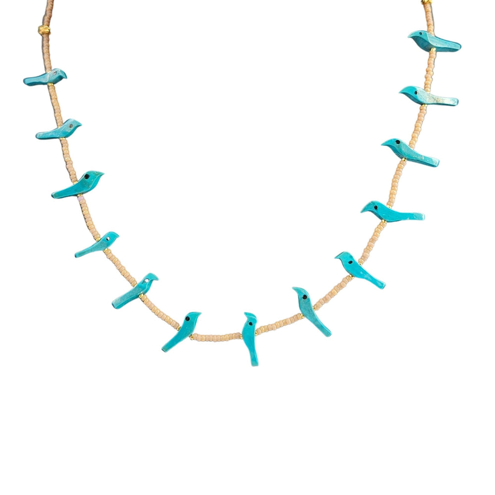 Necklace with turquoise bird-shaped pendants on a white background