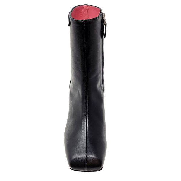 Black leather boot with a red interior on a white background