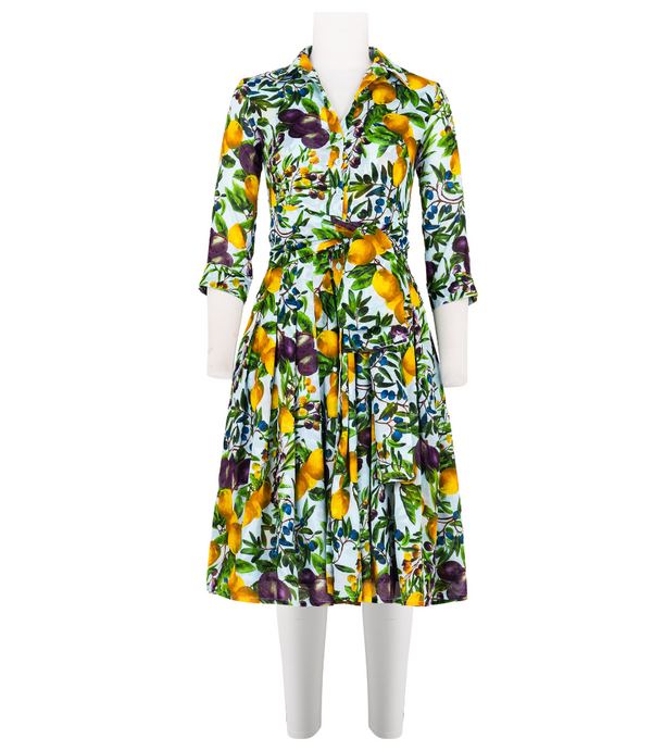 A knee-length dress with a collared neckline, three-quarter sleeves, and a flared skirt. Features a bold allover abstract pattern and fitted waist.