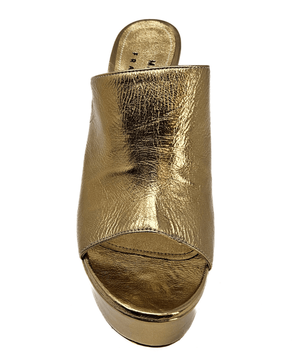 Open-toe platform mule with high block heel and wide upper strap. Features a smooth, metallic-textured finish and slip-on design for elevated wear.