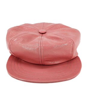 Pink leather cap on a white background
